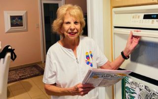 Suzanne Rosoff next to her microwave oven