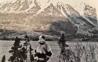 Suzanne Rosoff with snow-covered mountains (black and white)