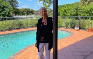 Suzanne Rosoff standing by the pool